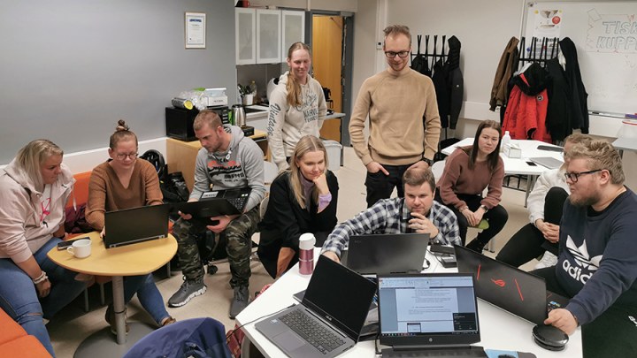 Students and instructors collaborating in a classroom workshop